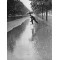 Anónimo - Man crossing puddle on chairs, 1934